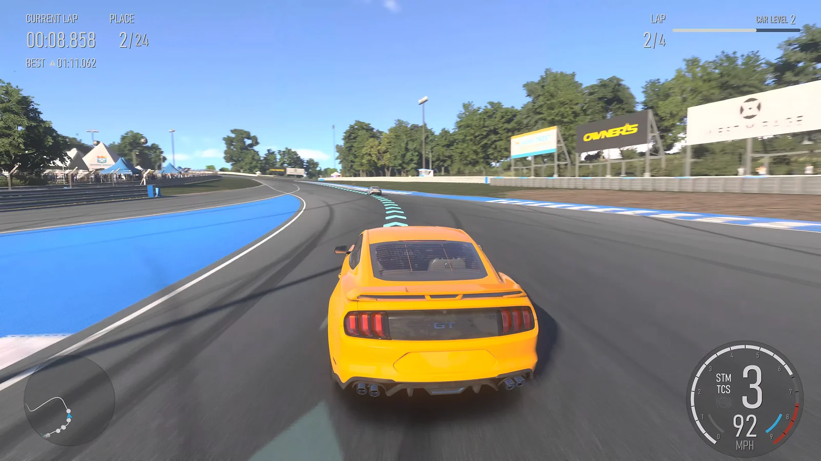 Racing Game: Forza Motorsport gameplay of a yellow Ford Mustang GT racing on a professional track