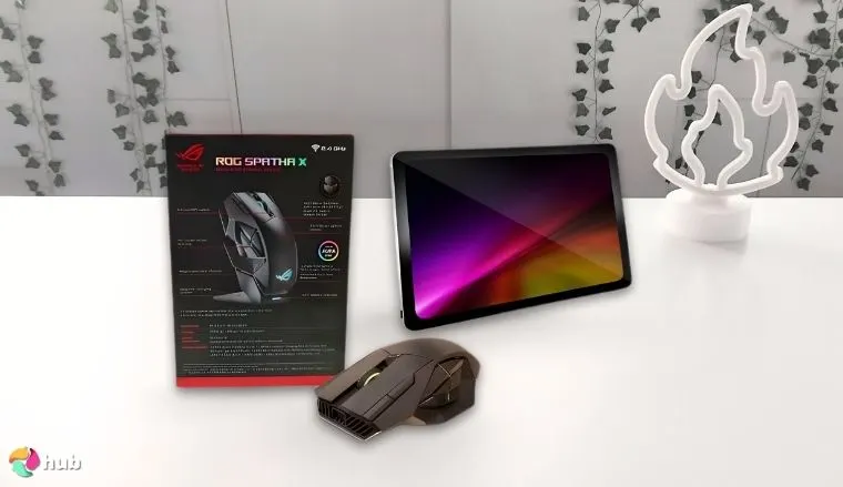 ASUS ROG Spatha X Wireless Gaming Mouse on a white office desk with minimal decor for a review