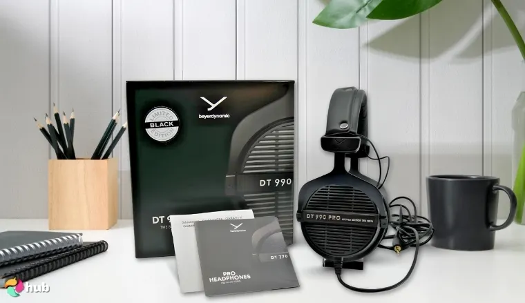 Beyerdynamic DT 990 Pro Headset on a white office desk with professional arrangement for a review