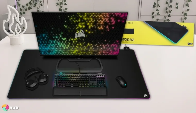 CORSAIR MM700 RGB Gaming Mouse Pad on a white office desk in a top-down view for a review