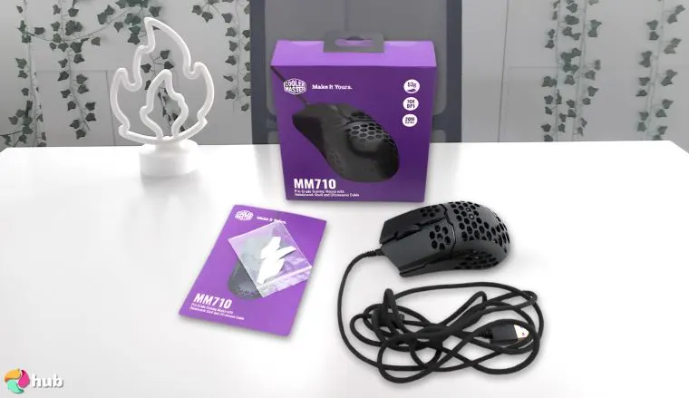 Cooler Master MM710 Mouse on a white office desk with simple styling for a review