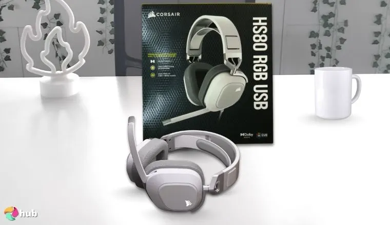 Corsair HS80 RGB Headset on a white office desk with soft lighting for a review