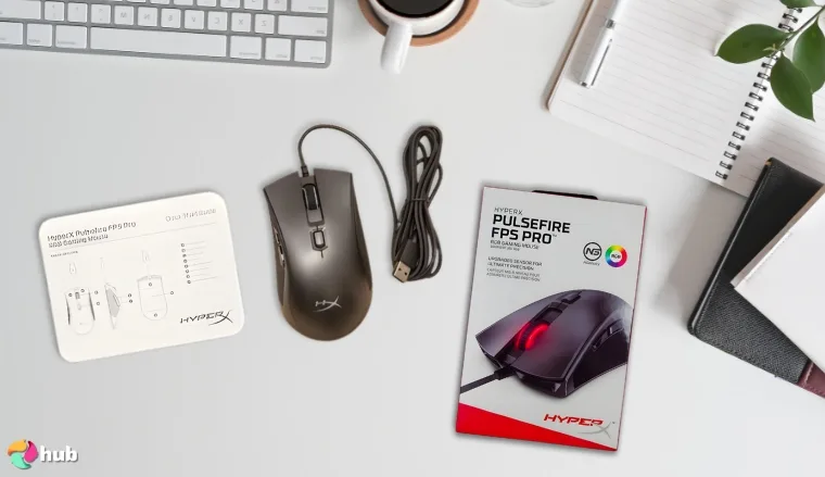 HyperX Pulsefire FPS Pro Gaming Mouse on a white office desk set up for testing and review