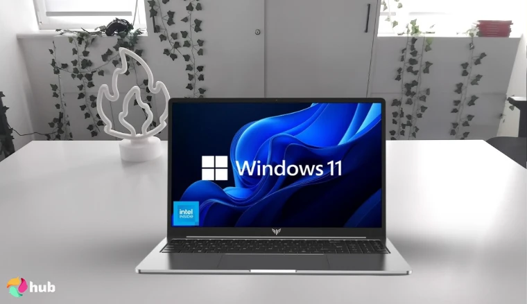 KAIGERR Ryzen 7 5825U Gaming Laptop on a white office desk in a minimalist setup for a review