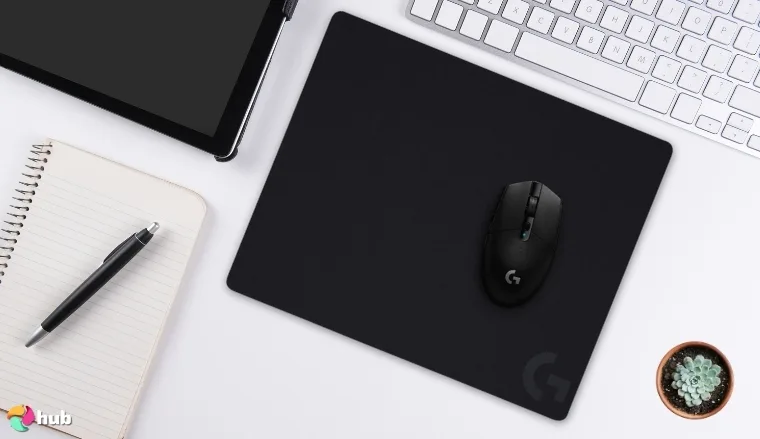 Logitech G440 Gaming Mouse Pad on a white office desk positioned for photography
