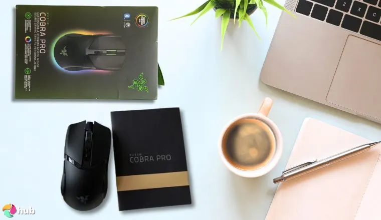 Razer Cobra Pro Mouse on a white office desk in a top-down view for a review