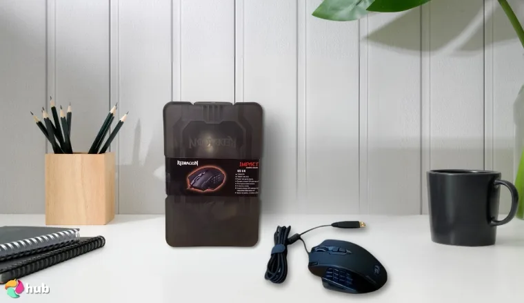 Redragon M908 Impact Gaming Mouse on a white office desk with neat arrangement for a review