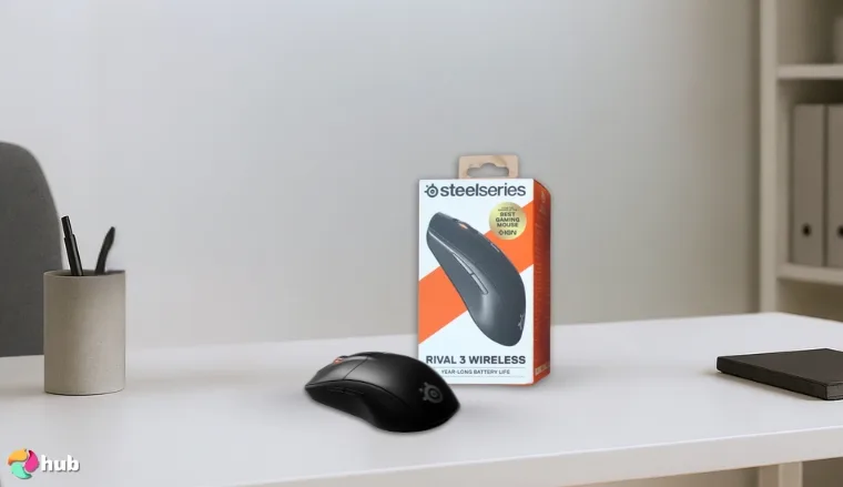SteelSeries Rival 3 Gaming Mouse on a white office desk with soft lighting for a review