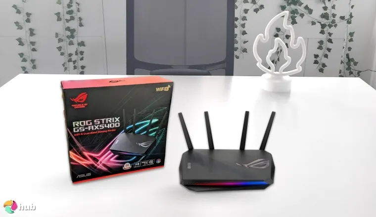 ASUS ROG Strix GS-AX5400 Streaming Router on a white office desk with minimal decor for a review