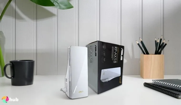 ASUS RP-AX58 Wi-Fi Extender on a white office desk positioned for photography