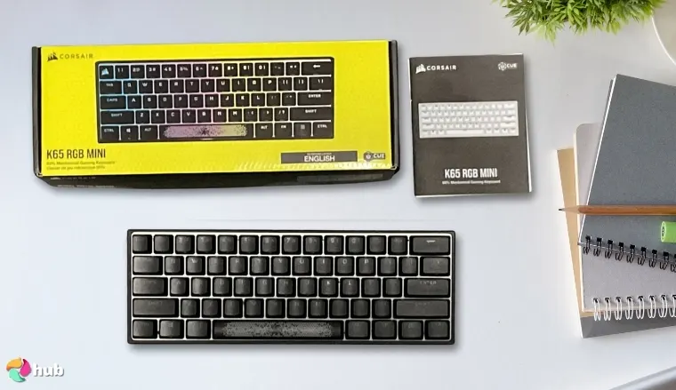 Corsair K65 PRO Mini RGB Gaming Keyboard on a white office desk with simple styling for a review