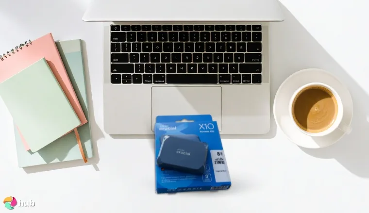 Crucial X10 Pro External SSD on a white office desk positioned for photography