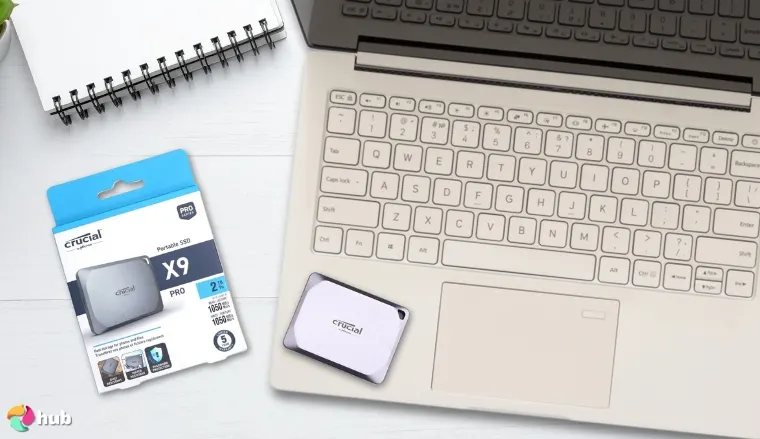 Crucial X9 Pro External SSD on a white office desk in a top-down view for a review