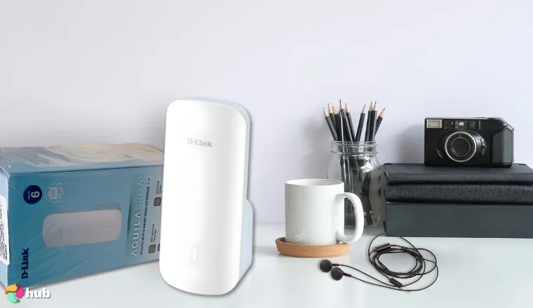 D-Link E30 AX3000 Wi-Fi Extender on a white office desk styled for promotional review