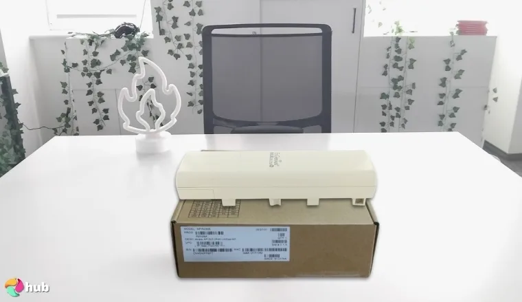 EnGenius ENH500-AX Outdoor Wi-Fi Extender on a white office desk in close-up for a review