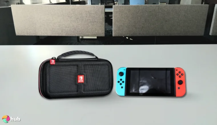 Game Traveler RDS Nintendo Switch Case on a white office desk in a clean setup for a review
