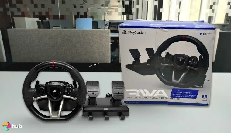 HORI Apex Sim Racing Wheel on a white office desk styled for promotional review