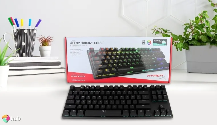 HyperX Alloy Origins Core Gaming Keyboard on a white office desk with balanced composition for a review