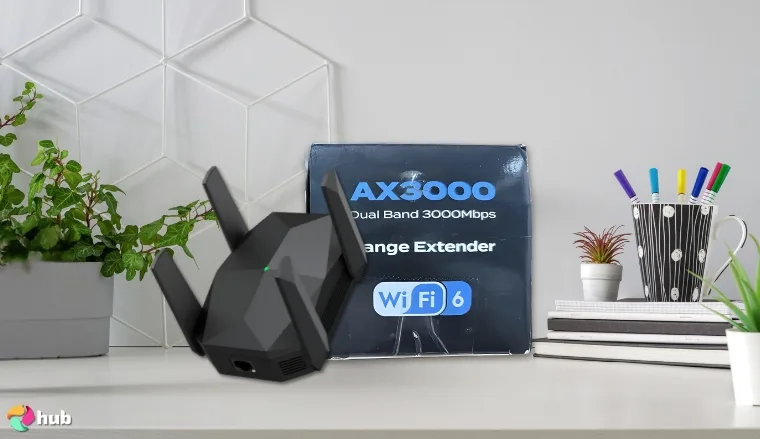 Ingabis AX3000 Wi-Fi Extender on a white office desk with creative arrangement for a review