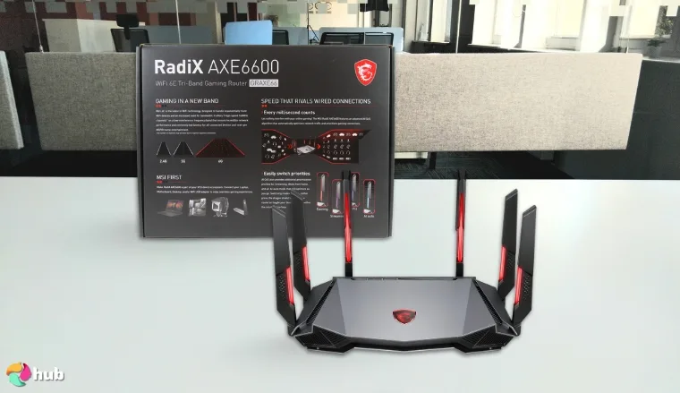 MSI Radix AXE6600 Gaming Router on a white office desk arranged for a review