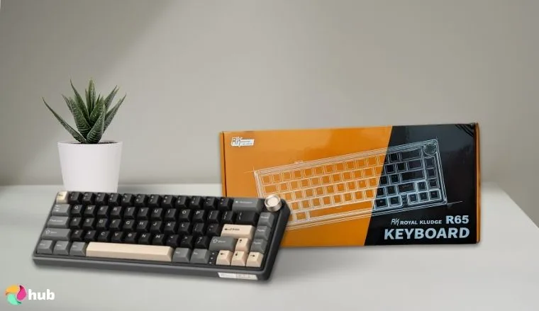 RK ROYAL KLUDGE R65 Keyboard on a white office desk in a minimalist setup for a review
