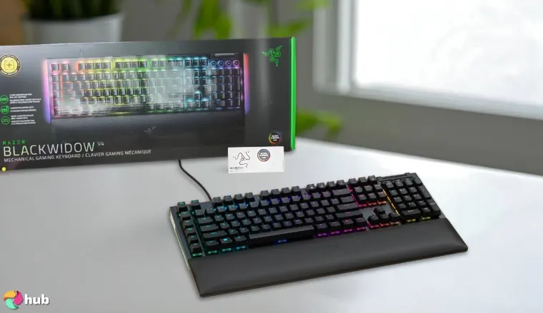 Razer BlackWidow V4 Keyboard on a white office desk with neat arrangement for a review