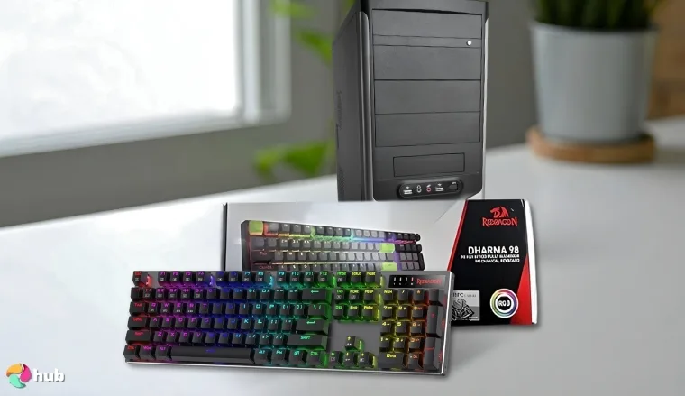 Redragon K556 PRO Gaming Keyboard on a white office desk with professional arrangement for a review