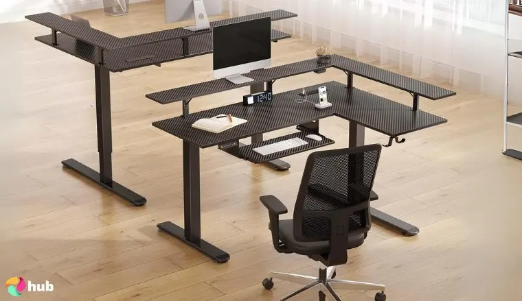 Rolanstar Carbon Fiber Black Gaming Desk in the office in a top-down view for a review