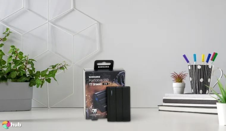 Samsung T7 Shield External SSD on a white office desk arranged for a review