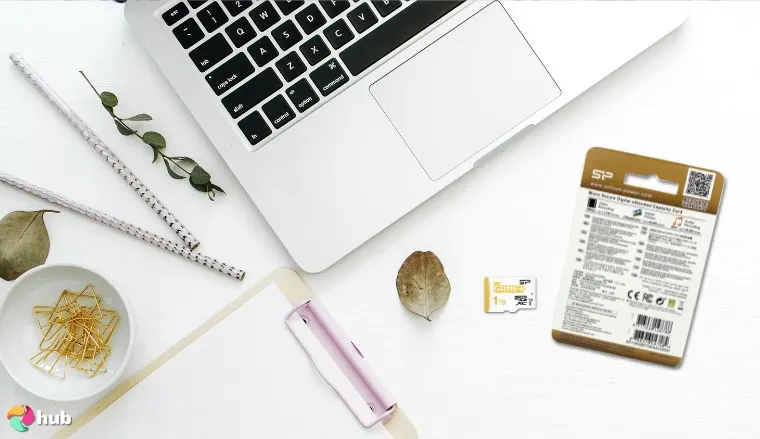 Silicon Power SDXC Memory Card on a white office desk with creative arrangement for a review