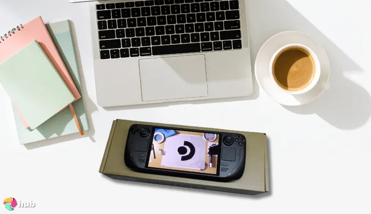 Steam Deck OLED Gaming Console on a white office desk with creative arrangement for a review