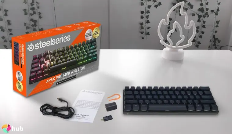 SteelSeries Apex Pro Mini Keyboard on a white office desk arranged for a review