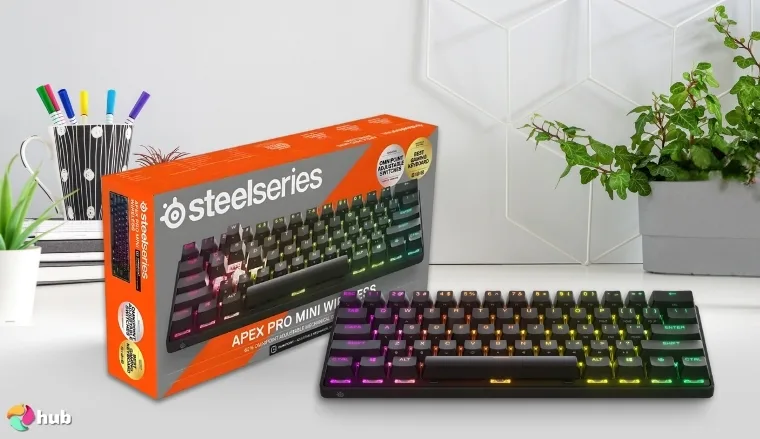 SteelSeries Apex Pro Mini Gaming Keyboard on a white office desk with neat arrangement for a review