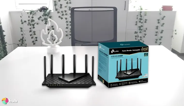 TP-Link (Archer AXE75) WiFi 6E Router on a white office desk in a bright workspace for a review