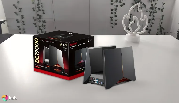 TP-Link Tri‑Band BE19000 Gaming Router on a white office desk with natural light ready for a review