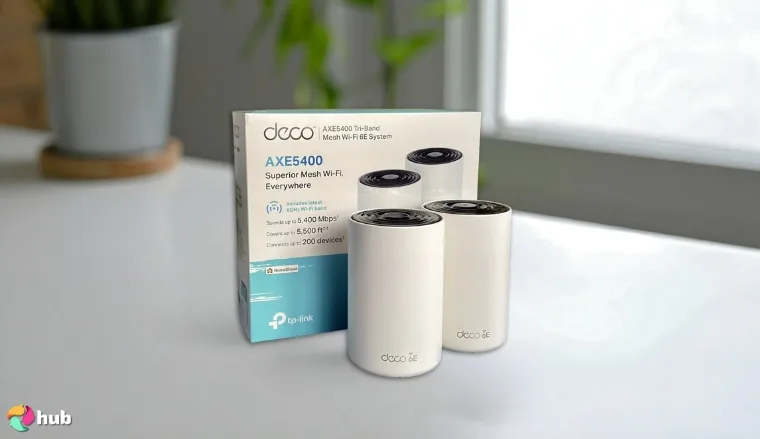 TP‑Link Deco AXE5400 Gaming Router on a white office desk prepared for testing shots