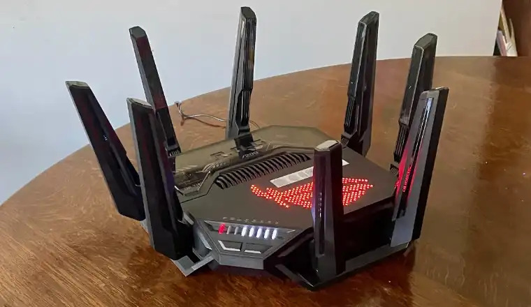 ASUS ROG Rapture GT-BE98 PRO router with eight antennas and red lighting.