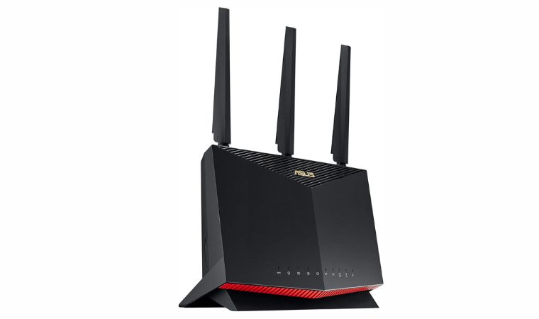 ASUS RT-AX86U Pro (AX5700) router with three antennas on table.