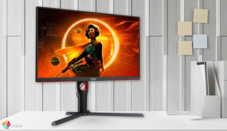 AOC Q27G3XMN Monitor on a white office desk in a minimalist setup for a review