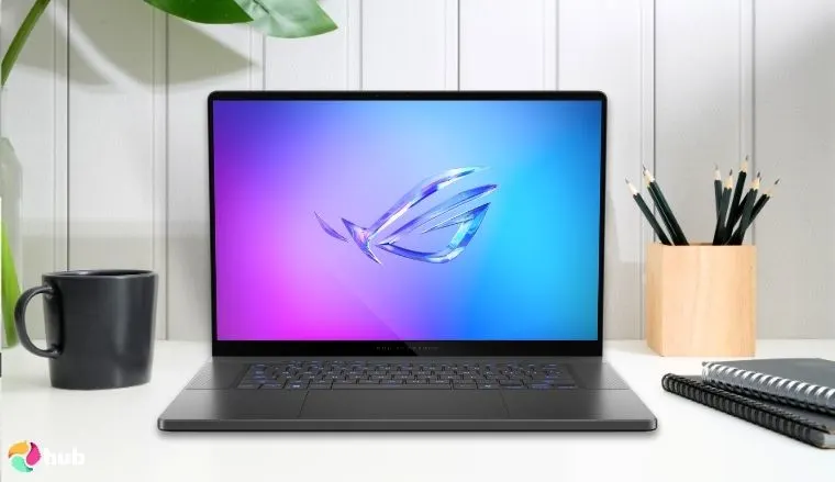 ASUS ROG Zephyrus G16 Laptop on a white office desk styled for a review