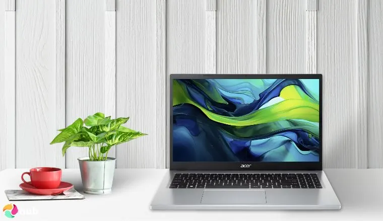 白色办公桌上摆放着 Acer Aspire Go 15 笔记本电脑,并配有创意布置以供审核