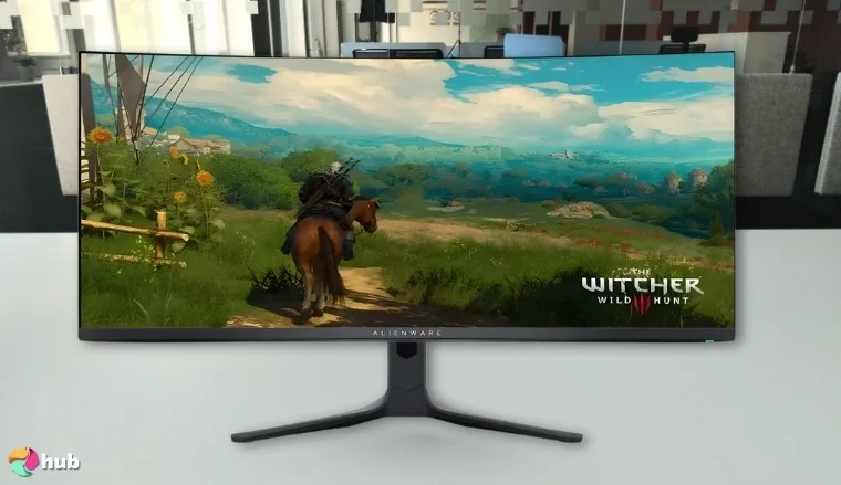 Alienware AW3423DWF Monitor on a white office desk in a well-lit setting for a review