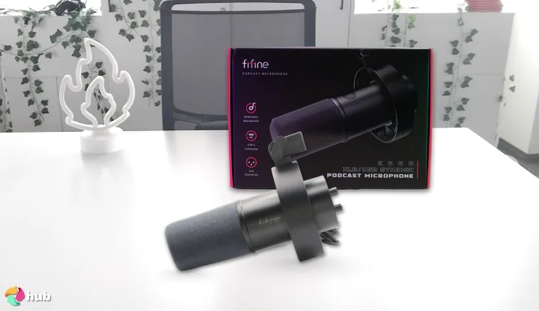 FIFINE K688 USB Microphone on a white office desk in a well-lit setting for a review