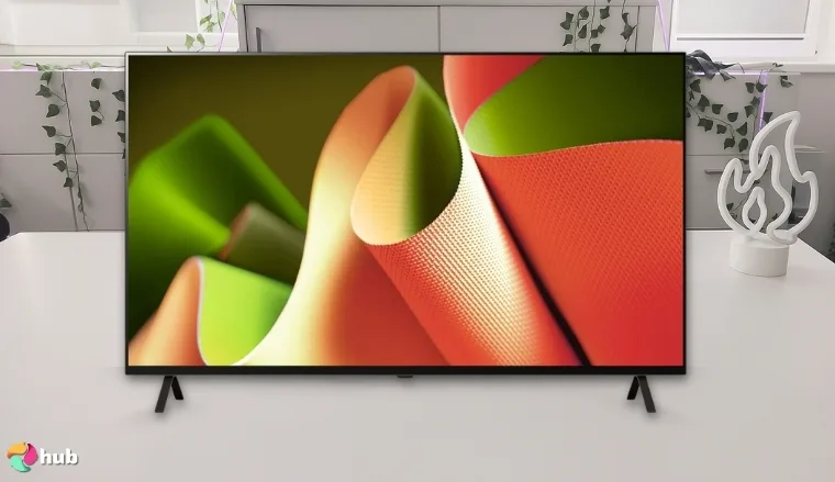 LG 55-Inch Class OLED B4 Series TV on a white office desk in a minimalist setup for a review