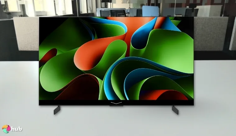 LG 65-Inch OLED C4 TV on a white office desk with simple styling for a review