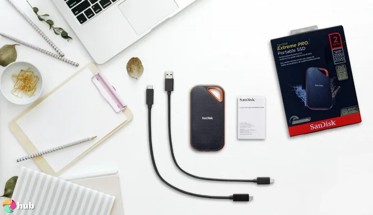 SanDisk Extreme PRO Gaming External SSD on a white office desk with creative arrangement for a review