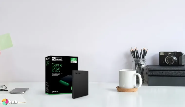 Seagate (STKX2000400) External HDD on a white office desk with an editorial style for a review