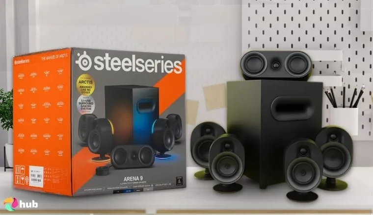 SteelSeries Arena 9 Gaming Speakers on a white office desk in a clean setup for a review