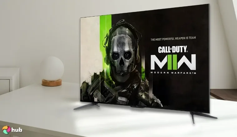 TCL 55-Inch QM7 TV on a white office desk photographed for a review