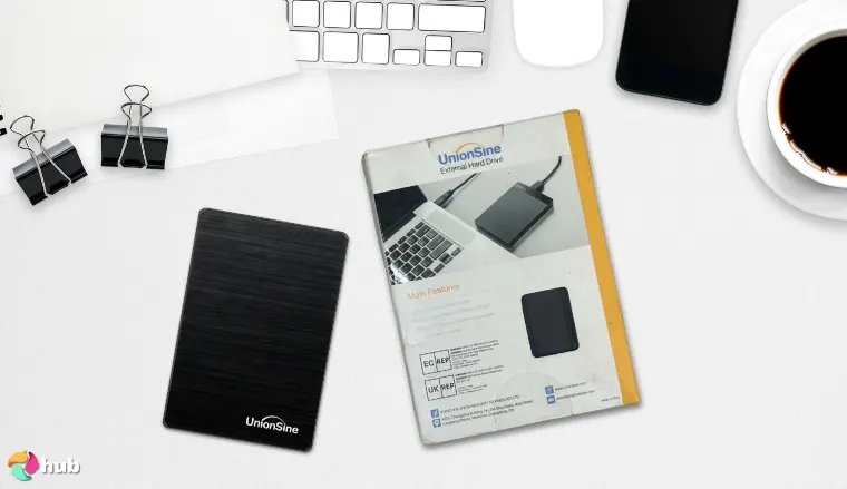 UnionSine 1TB Ultra Slim External HDD on a white office desk in a top-down view for a review